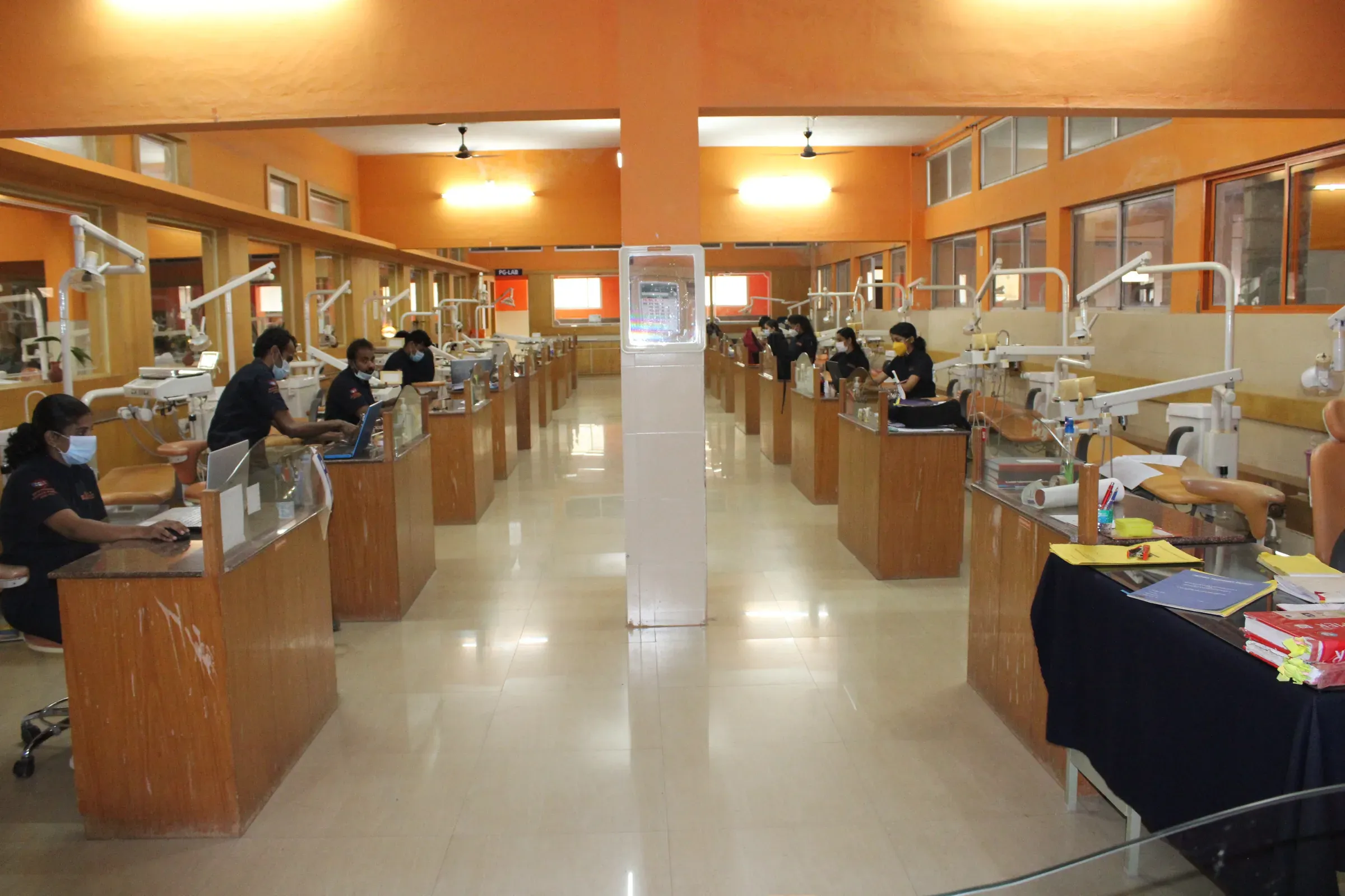 Dental clinical facility with students and supervised treatment areas