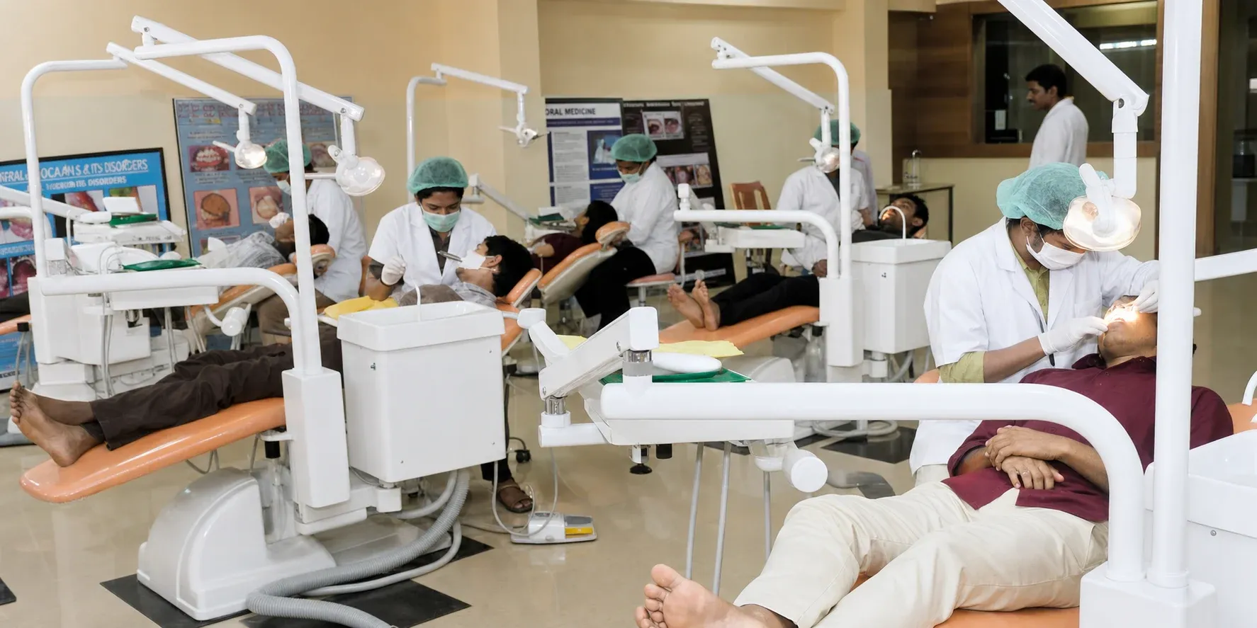 Multi-chair clinical department with clinicians treating patients