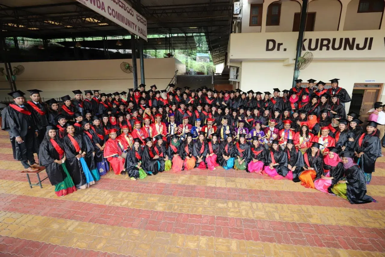Graduating students and faculty gathered for a group photograph