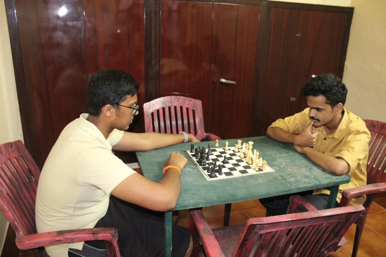 Students playing chess in the KVG campus indoor games facility