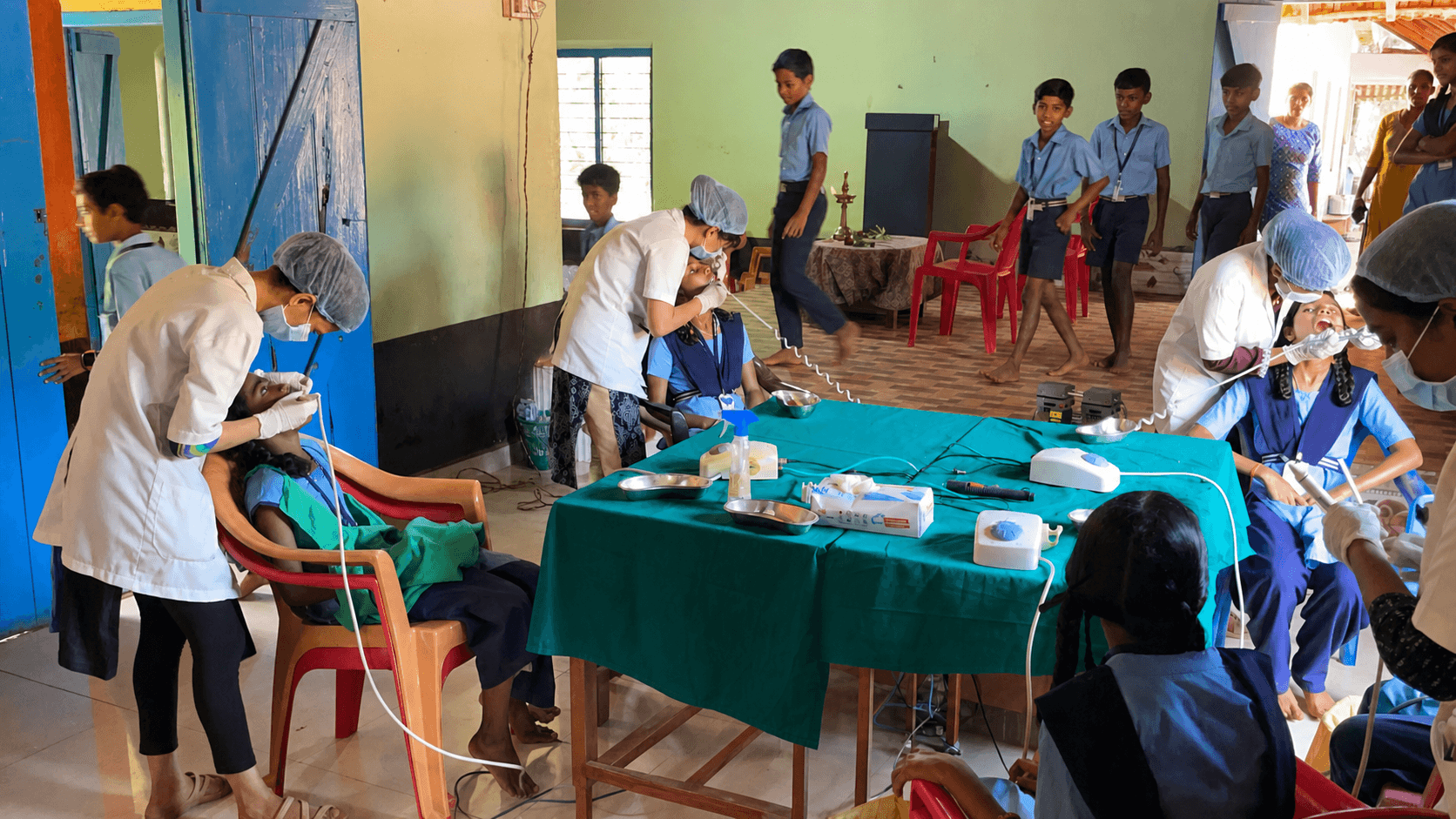Dental students providing care during a community camp