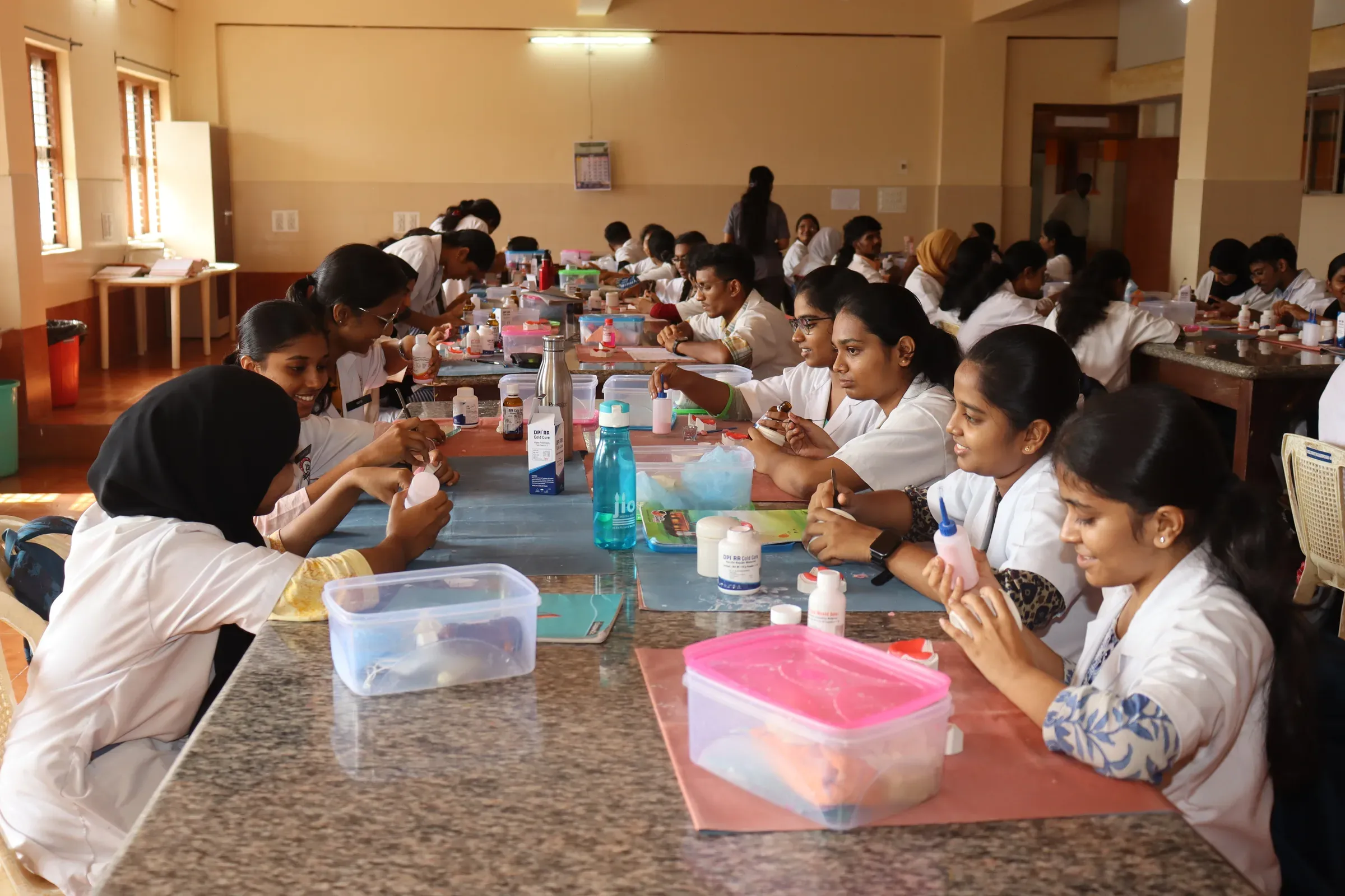 Dental students working together during a practical learning session