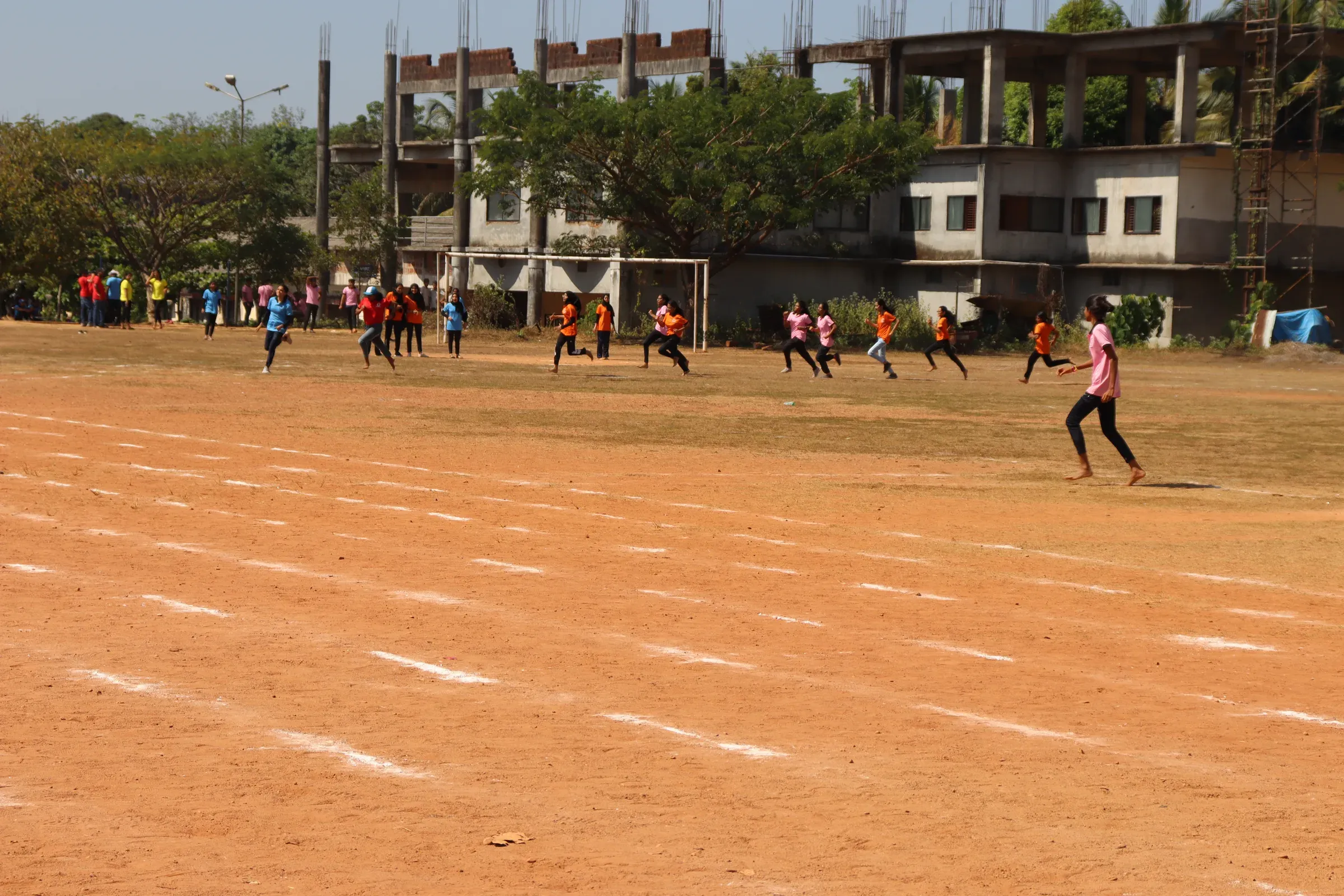 Students playing on the KVG campus sports ground